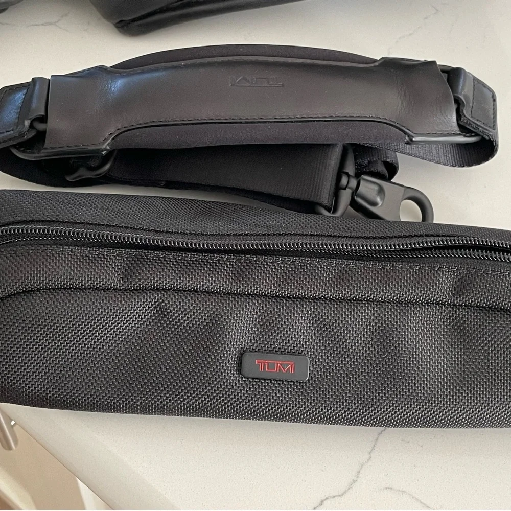 Tumi leather T pass medium laptop bag.Briefcase bag.Lots of pockets .